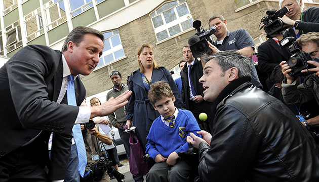 Election campaign: David Cameron is confronted by a father who has a child with special needs