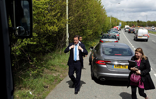 Election campaign: David Cameron adjusts his jacket after leaving his Jaguar car