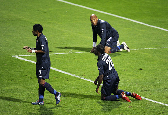 Lyon v Bayern Munich: Lyon's Michel Bastos, left, Aly Cissokho, right, and Jean-Alain Bousmong