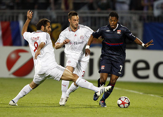Lyon v Bayern Munich: Lyon's Michel Bastos vies for the ball with Bayern Munich's Hamid Altintop