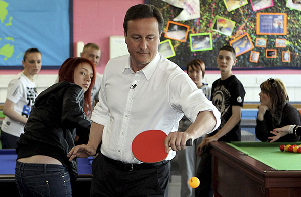 Election campaign: David Cameron plays table tennis in the 'Bolton Lads and Girls Club'