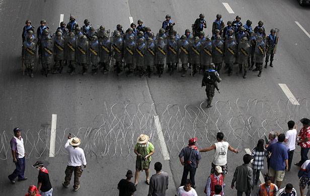 Thailand protests: Thai army soldiers face anti-government red-shirt protesters in Bangkok