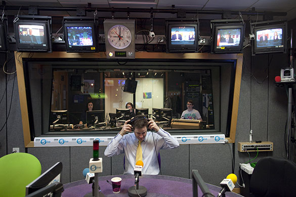 Campaigning with Clegg: Nick Clegg puts on headphones ahead of a Radio Five live phone-in