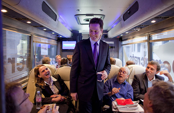 Campaigning with Clegg: Nick Clegg greets journalists and Michael Atherton on the campaign bus