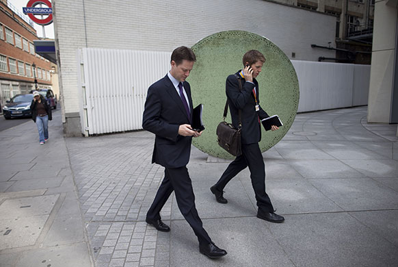 Campaigning with Clegg: Nick Clegg and his aide Mike Girling arrive at The Work Foundation