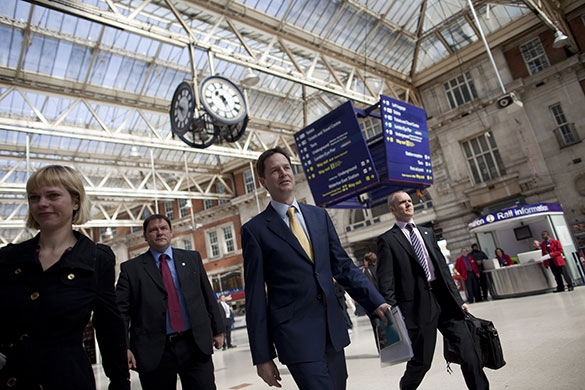Campaigning with Clegg: Nick Clegg walks through Waterloo train station