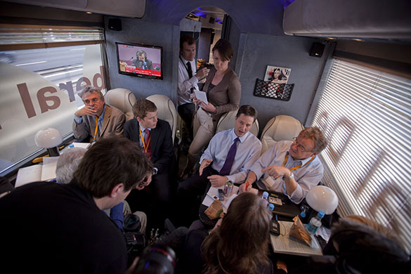 Campaigning with Clegg: Nick Clegg speaks to journalists on his battle bus on the way to Oxford