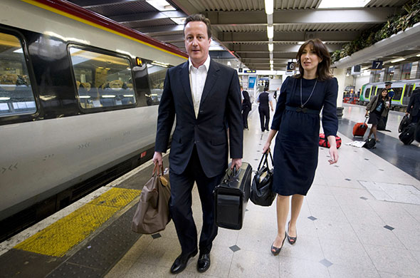 Election campaign: David Cameron and his wife Samantha arrive at Euston train station
