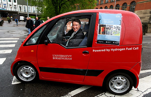 Election campaigning: Business Secretary Peter Mandelson is driven in a electric car 