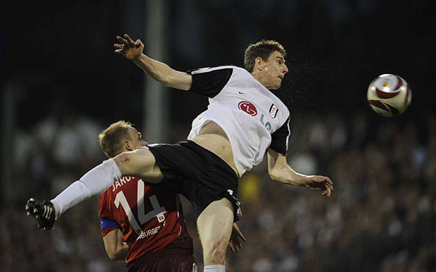 Fulham v Hamburg: Zoltan Gera climbs above Jarolim to win the ball