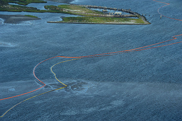 Deepwater oilrig: Oil booms snake around land in Breton Sound in Louisiana