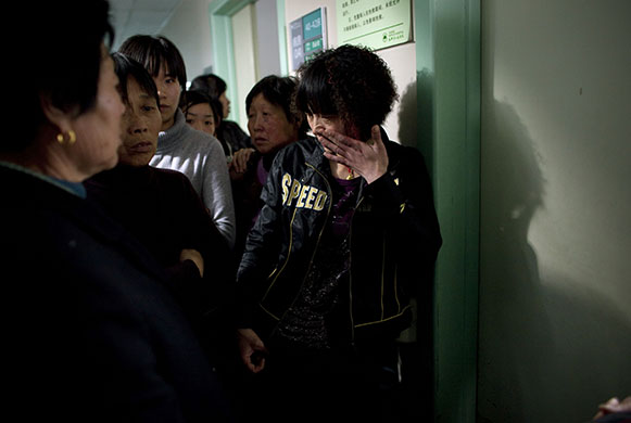 China school violence: A mother of a child who was attacked at the Zhongxin Kindergarten cries