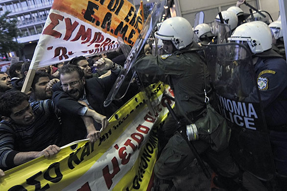 Greece protests: Protestors clash with riot policemen in front of the finance ministry