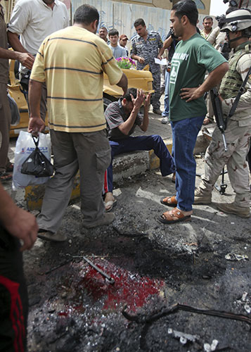 Baghdad explosions: The site of a car bomb attack near the Iranian Embassy