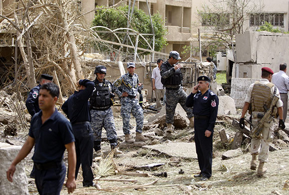 Baghdad explosions: Security forces inspect the damage at the entrance of the Egyptian embassy