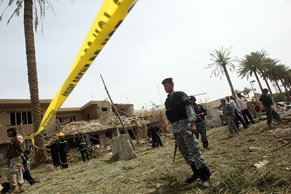 Baghdad explosions: Security forces inspect the damage outside Egyptian embassy