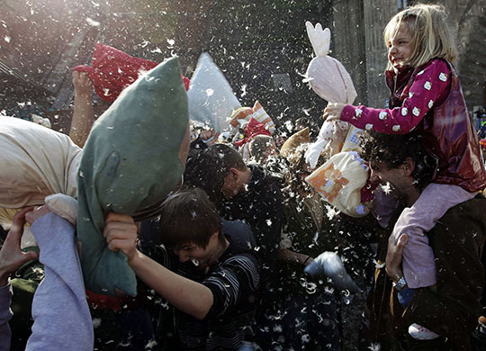 24 hours in pictures: Budapest, Hungary: People fight with during International Pillow Fight Day