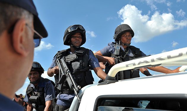24 hours in pictures: Venterdorp, South Africa: Police enter the farm of Eugene Terre'Blanche