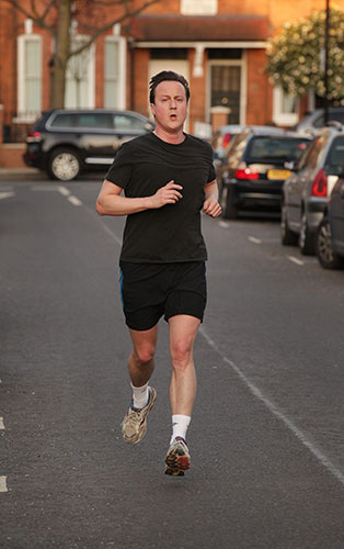 brown calls election: Conservative party leader David Cameron returns from a run