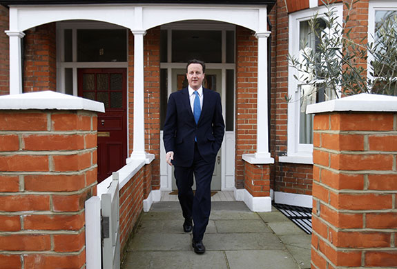 brown calls election: David Cameron speaks to the media as he leaves his house