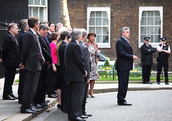 brown calls election: Brown makes a statement outside No 10 as the Labour front bench looks on