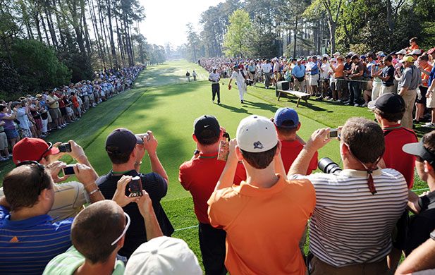 24 hours in pictures: Augusta, US: Tiger Woods walks to the tee during a practice round
