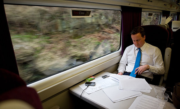Election campaign: Conservative leader David Cameron works on a train from Birmingham to Leeds