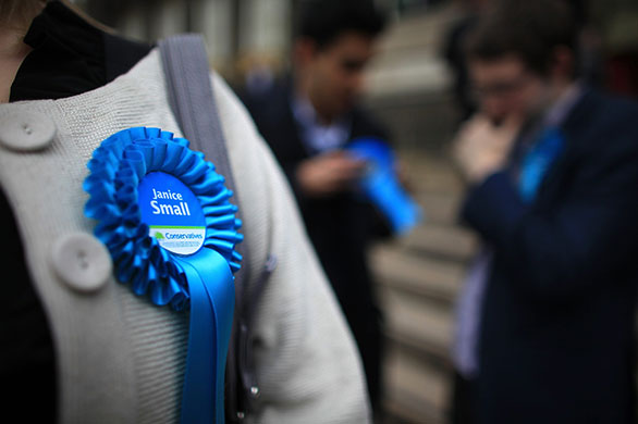 Election campaign: Supporters of prospective parlimentary candidate Janice Small wear rosettes