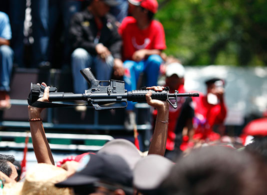 24 hours in pictures: thai redshirt protesters storm parliament