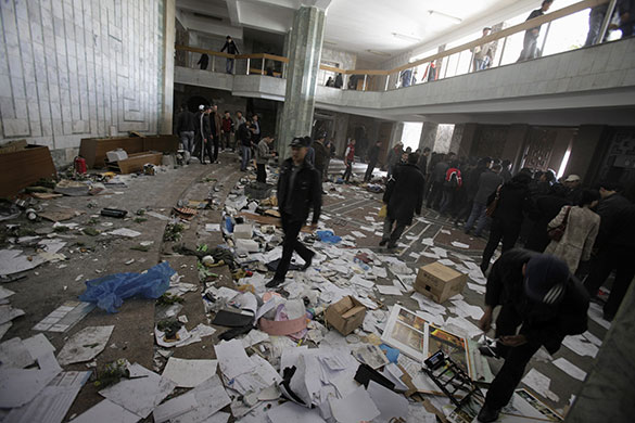 Kyrgyzstan: Protesters walk inside the damaged Kyrgyz government building