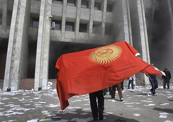 Kyrgyzstan: A protester in front of government headquarters 