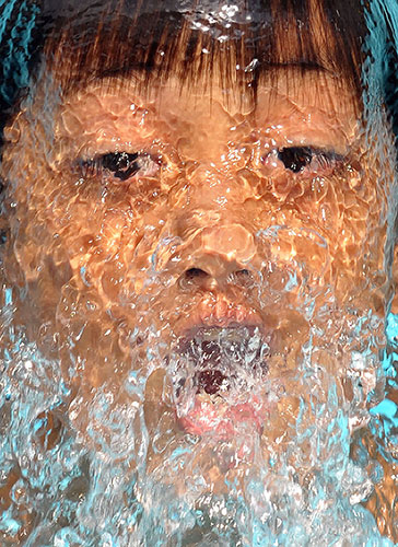 24hours: A boy swims in a public pool, Manila, PhilippineS