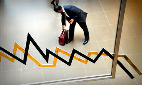 A man picks up his bag in the Athens stock exchange 