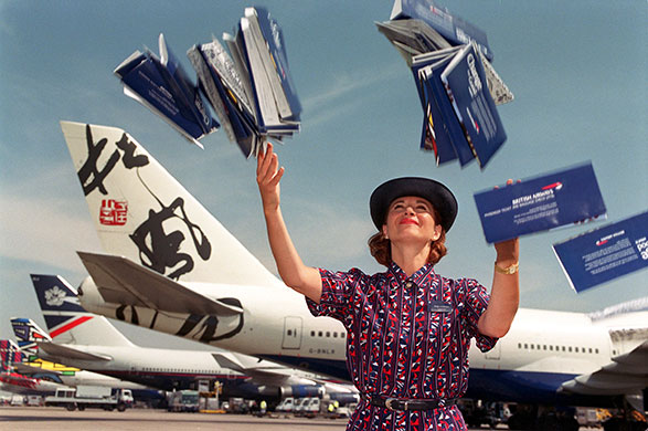 British Airways merger: 1998: a BA air stewardess promotes a British Airways fares offer