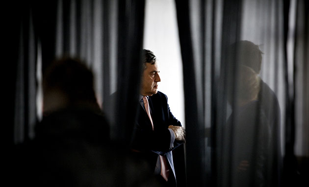 Martin Argles: Gordon Brown consults staff in a break between interviews