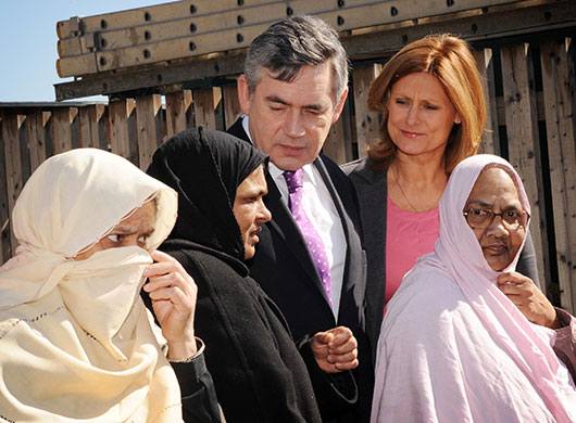 Election campaign: Gordon Brown and his wife Sarah meet community staff at Bromley By Bow