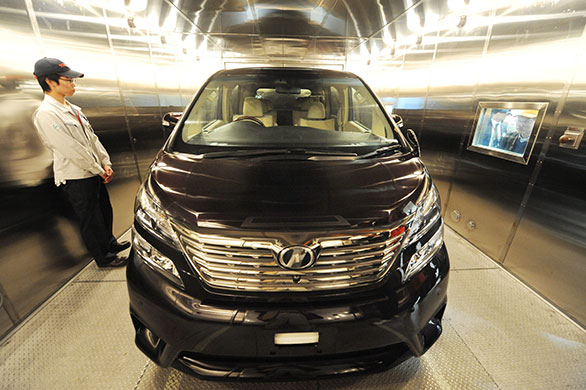 Week in Business: Toyota employee with a car inside the extreme temperature test laboratory