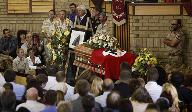 terreblanche update: Family members and supporters stand next to Eugene Terre'Blanche coffin