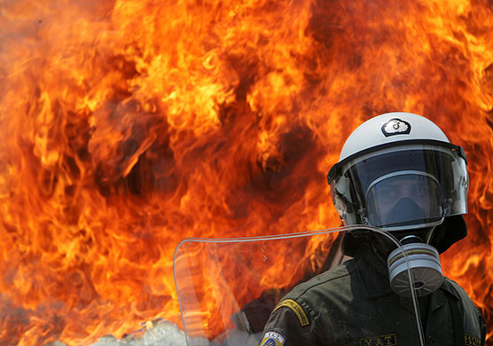 Athens Riot: Protesters clash with riot police during a demonstration in Athens on 1 May