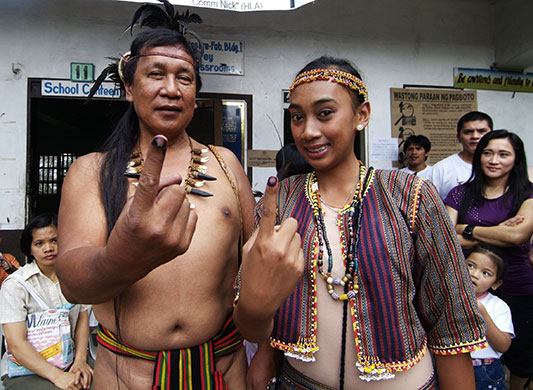 Philippine elections: Igorot tribespeople show off their fingers stained with indelible ink