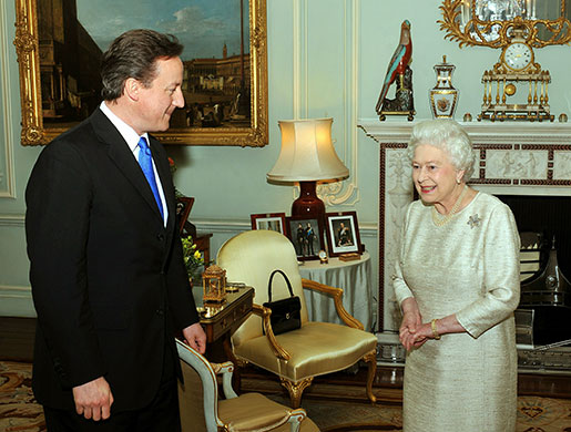 Cameron's big day: Queen Elizabeth II greets David Cameron at Buckingham Palace