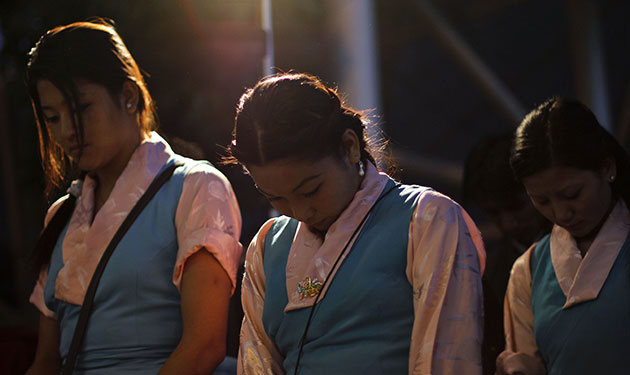 24 hours in pictures: candlelit vigil for Qinghai earthquake victims