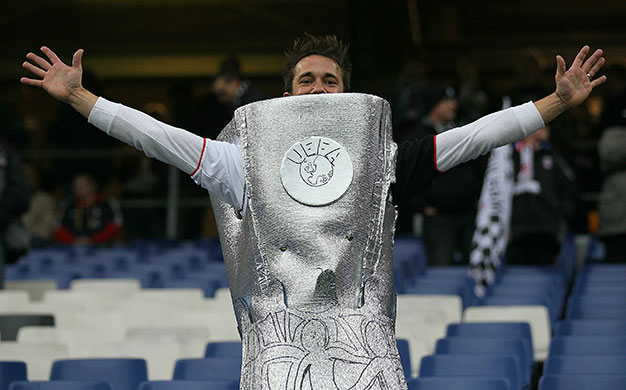 Europa League Final: Fulham fan wearing a replica Europa League trophy costume