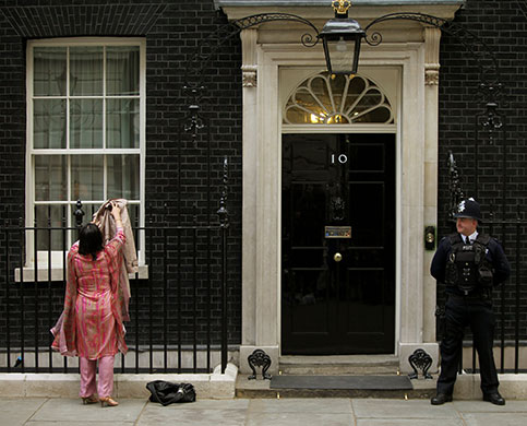 cabinet meeting: Lady Warsi adjusts her clothing after leaving number 10