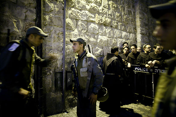 24 hours in pictures: Jerusalem: Catholic monks are stopped at a checkpoint