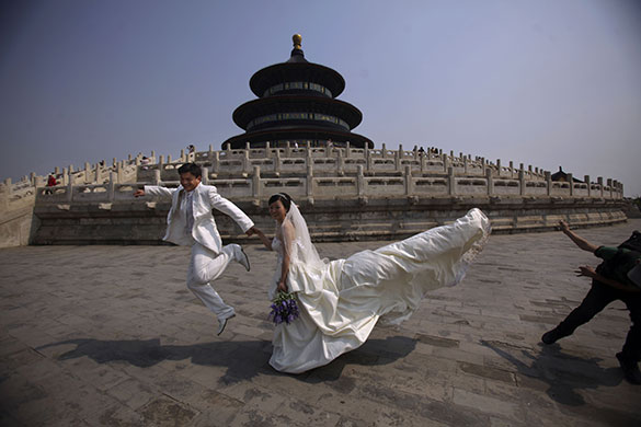 24 hours in pictures: Beijing, China: A bride and groom at a photo shoot