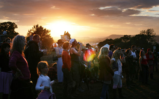 Glastonbury at 40: Glastonbury Festival 2007 : Festivalgoers on a hillside at sunset