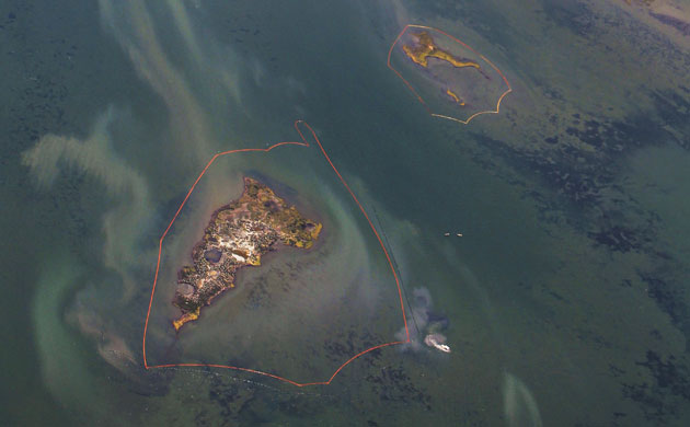 Deepwater Horizon: Oil Spill Begins To Reach Land: Oil booms, Chandeleur Islands, Louisiana