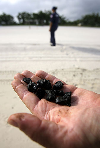 Deepwater Horizon: Gulf Oil Spill Begins To Reach Land: tar balls, Pass Christian, Mississippi