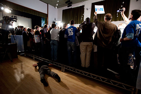 Guardian election: A sound technician adjusts some wiring as David Cameron speaks